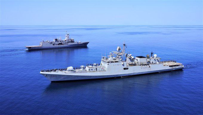 Indian Navy frigates conducting sea formation exercises guided by autonomous surveillance and naval intelligence